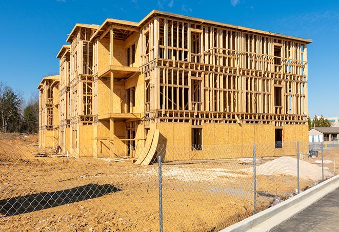 a temporary chain link fence in front of a building under construction, ensuring public safety in Berry Creek CA